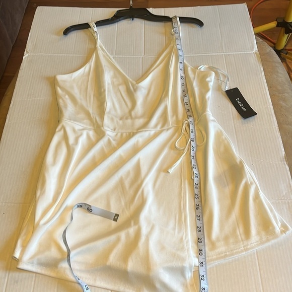 NWT-Bebe-XL-white-stretchy, adjustable straps, wrap skirt romper. Built in short - Picture 11 of 13